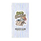 Striped towel with 'Bible Baddies' and 'Beach Club' text and beach-themed graphics.