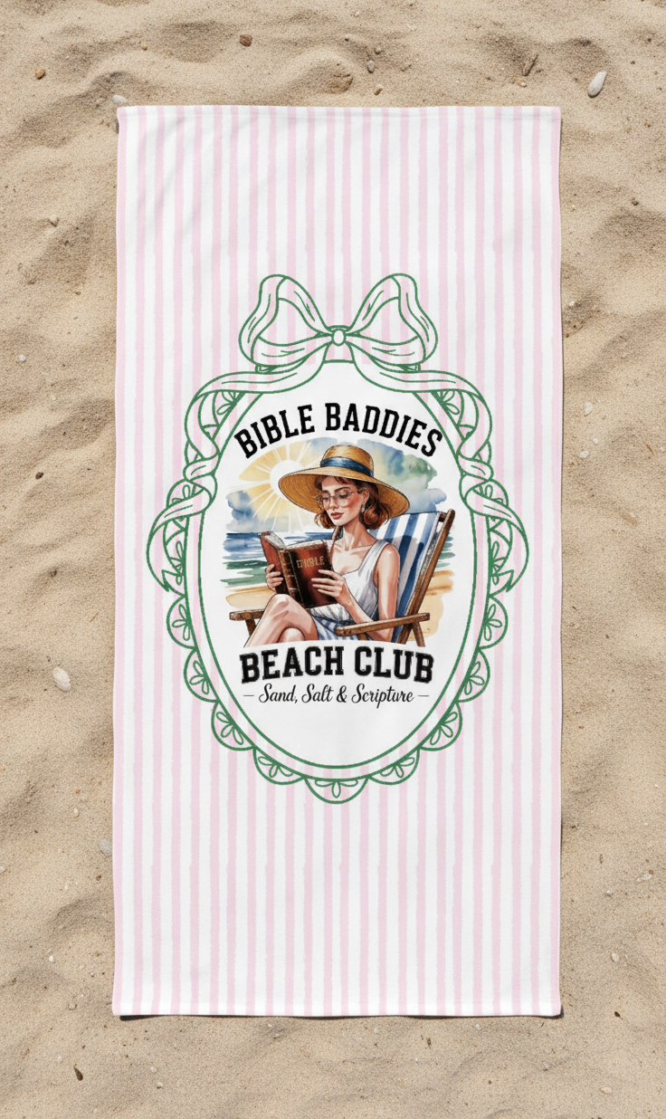 Beach towel with 'Bible Baddies Beach Club' design on a sandy background