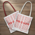 Two tote bags with 'GOD IS GOOD' text on a wooden surface