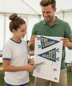 Two people working on a VBS Legend sign at an event.