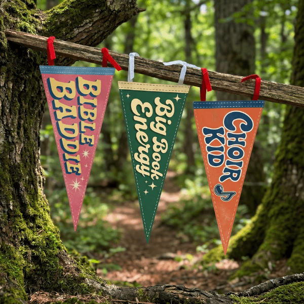 Holy Smoak Studios Camp Believers pennants hanging outdoors, Bible Baddie Big Book Energy Choir Kid wholesale Christian giftware