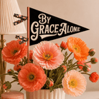 By Grace Alone finished pennant displayed with poppy flowers, Holy Smoak Studios Camp Believers wholesale faith-based product