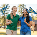 Two women holding finished VBS Legend pennants outdoors, Holy Smoak Studios Camp Believers wholesale Christian giftware