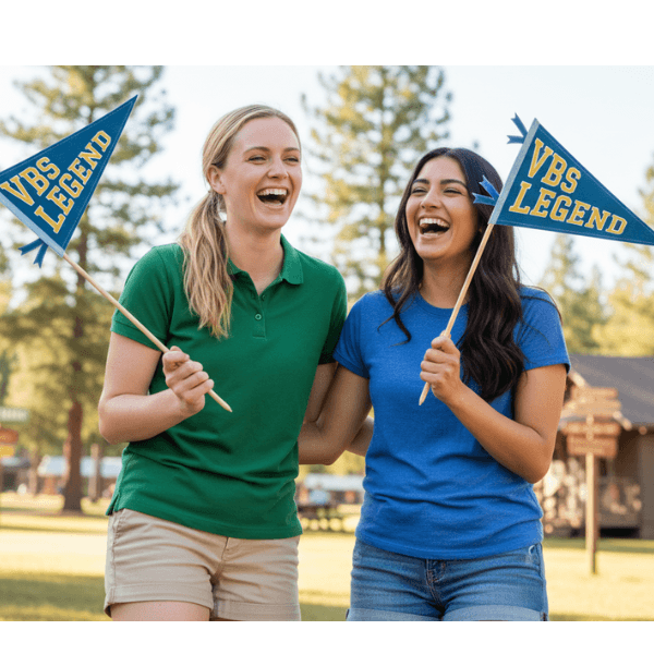 Two women holding finished VBS Legend pennants outdoors, Holy Smoak Studios Camp Believers wholesale Christian giftware