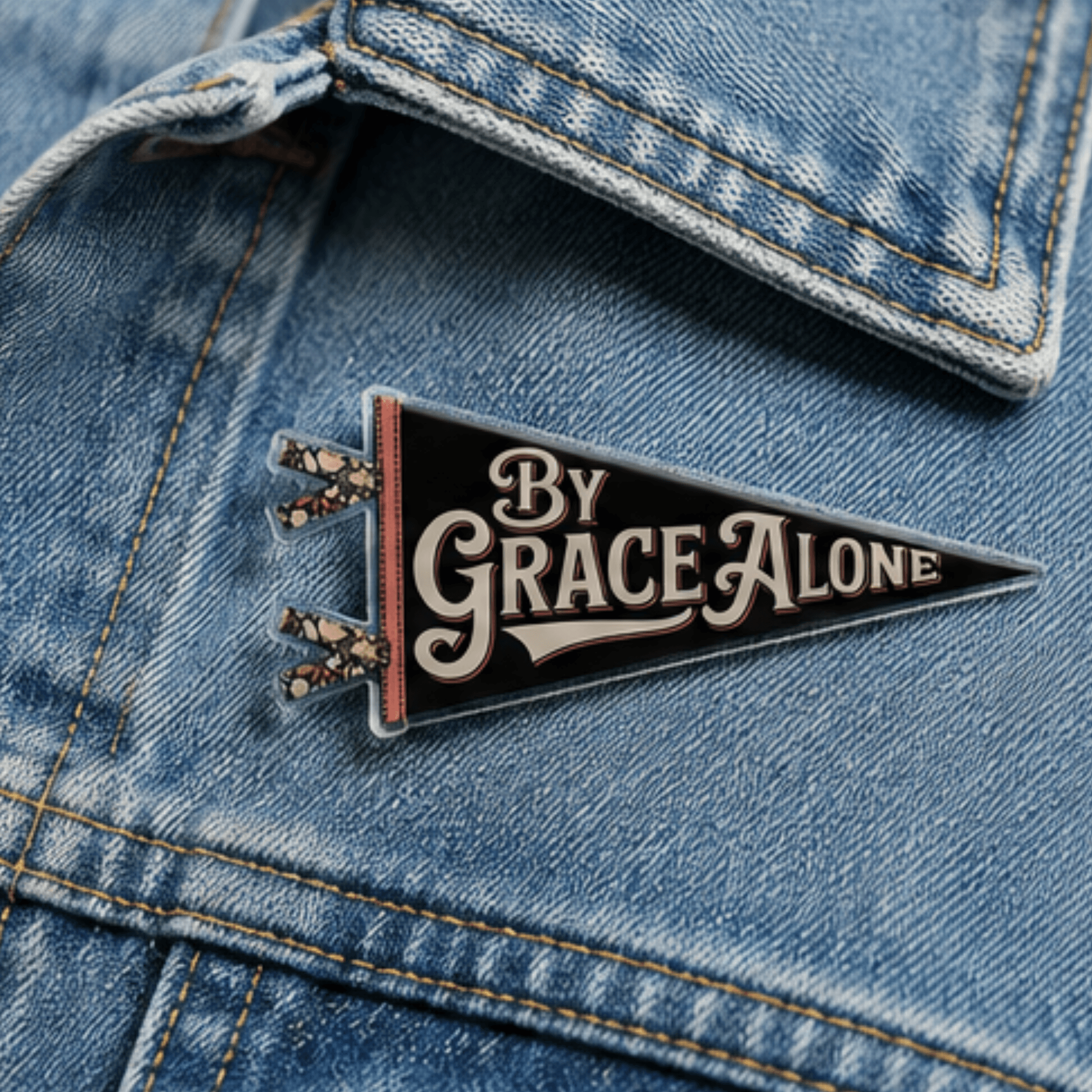 By Grace Alone Camp Believers pennant pin on denim jacket, Holy Smoak Studios wholesale faith accessories for Christian retailers