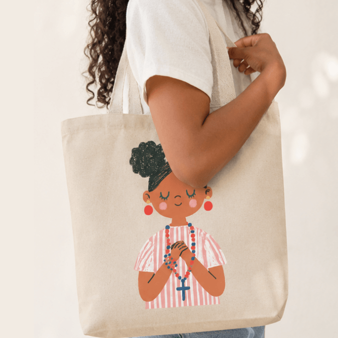 First Holy Communion Girl Tote Bag Dark Skin Tone carried on shoulder, Holy Smoak Studios wholesale faith-based retail product